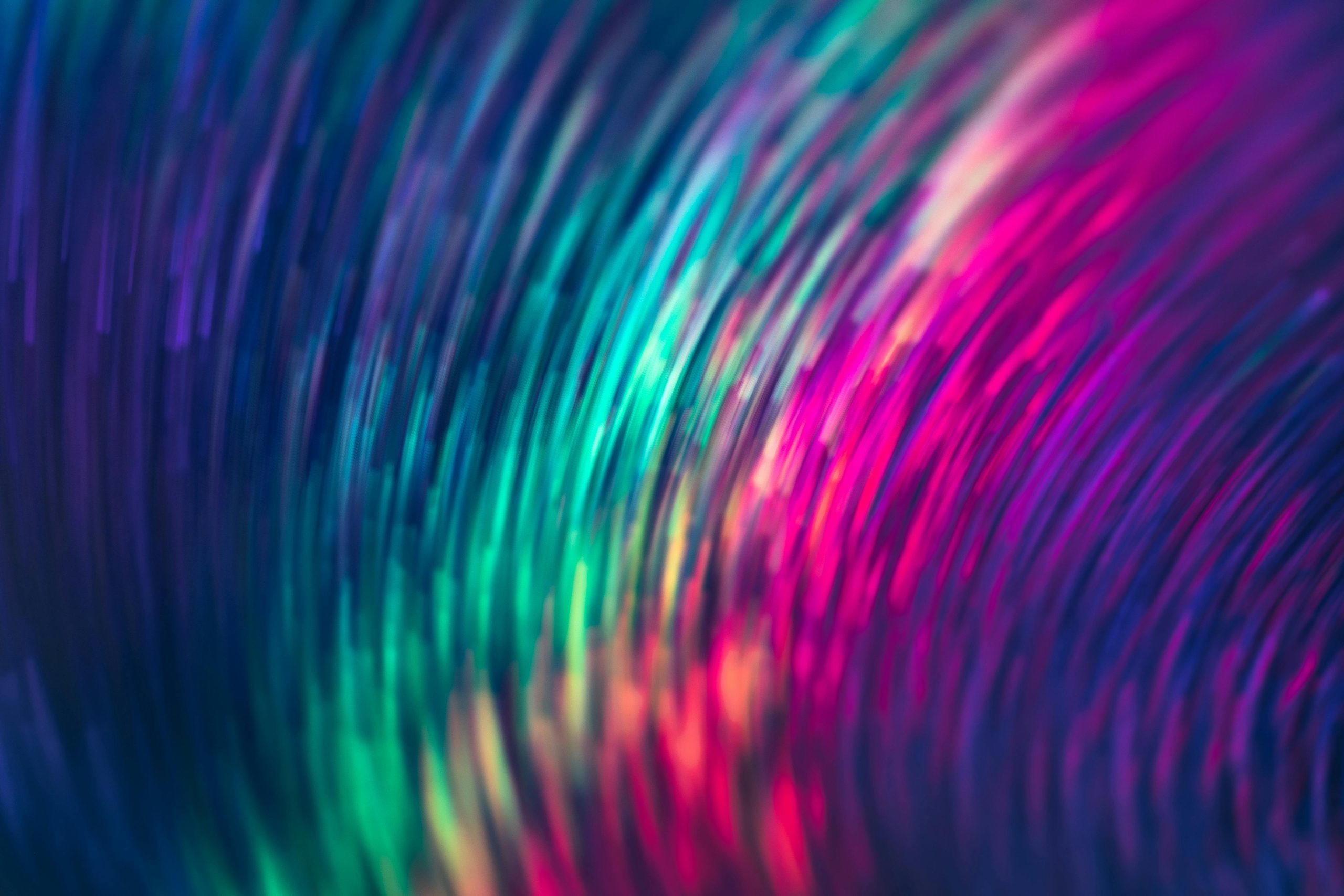 Colorful abstract background with vibrant swirling patterns in shades of purple, blue, green, and pink, ideal for an aura test and quiz site to discover your unique aura color.