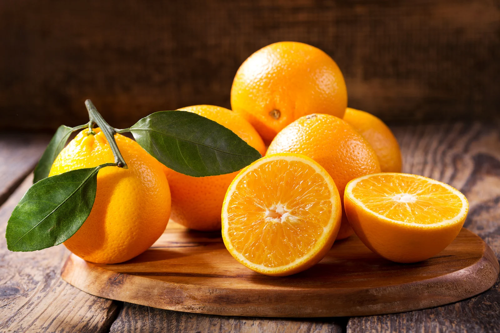 oranges on wooden board